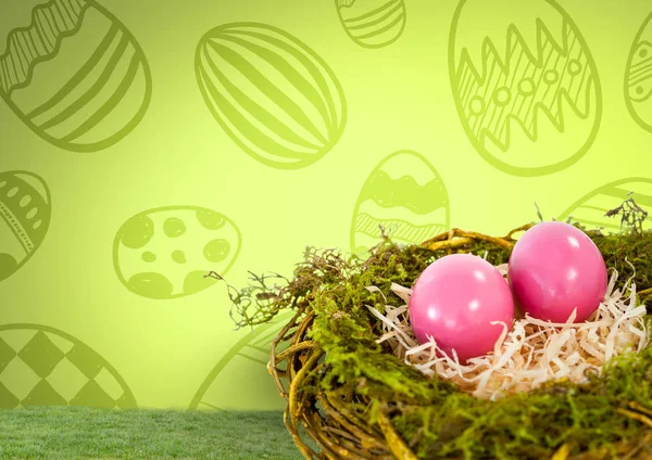 Easter eggs in nest in front of pattern — Stock Photo, Image
