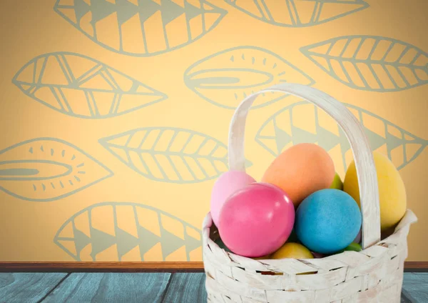 Easter eggs in basket in front of pattern — Stock Photo, Image