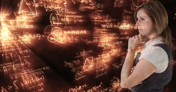 Digitale Composietbeeld van doordachte zakenvrouw met wiskundige vergelijkingen — Stockfoto