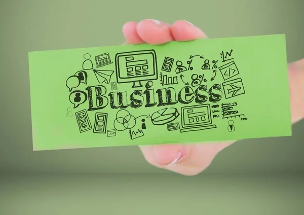 Mão segurando o cartão com desenhos gráficos de negócios — Fotografia de Stock