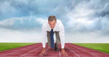 Businessman at starting position on tracks  clipart