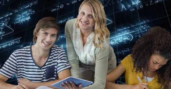 Female teacher holding tablet PC by students — Stock Photo, Image