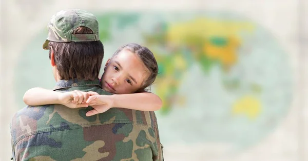 Soldier and daughter against blurry map — Stock Photo, Image