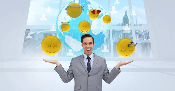 Empresário com vários emojis contra globo — Fotografia de Stock