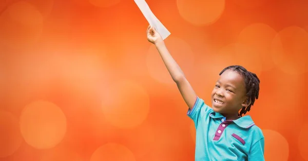 Happy girl holding document against orange background — Stock Photo, Image
