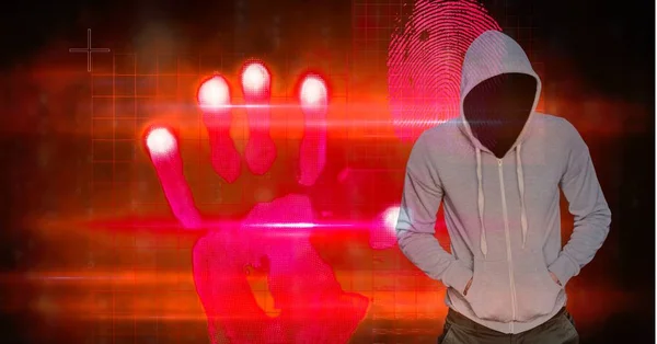 Hacker with hands in pockets standing by hand shape — Stock Photo, Image