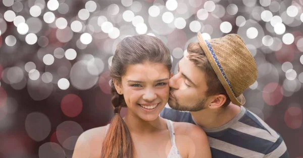 Happy woman being kissed by man — Stock Photo, Image