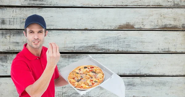 Чоловік-доставка жестикулює, тримаючи піцу — стокове фото