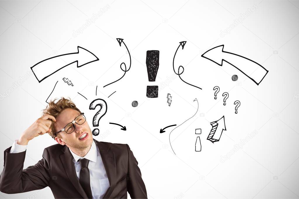 confused businessman with question marks 