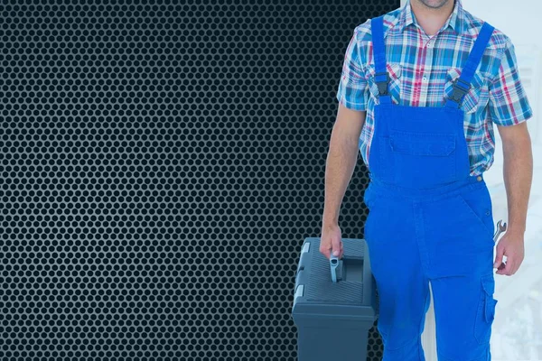 Imagem composta do homem segurando uma caixa de ferramentas — Fotografia de Stock