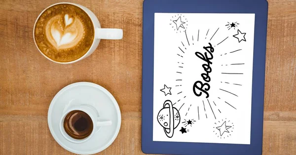 Grafika książki na ekranie tabletu przez filiżanek do kawy — Zdjęcie stockowe