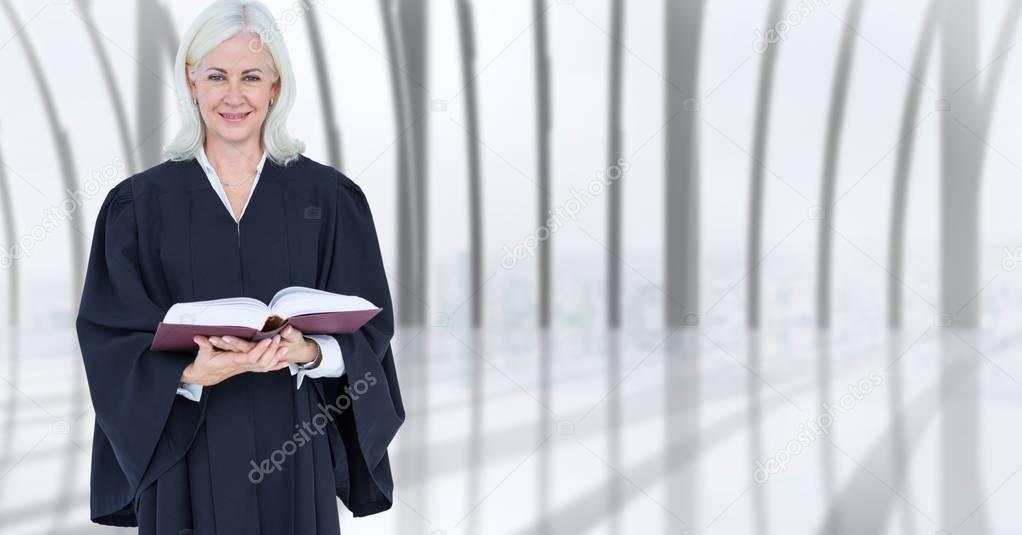Confident female judge holding book