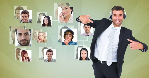 Customer care representative gesturing by flying portraits — Stock Photo, Image