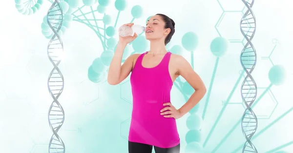 Woman drinking water against DNA — Stock Photo, Image