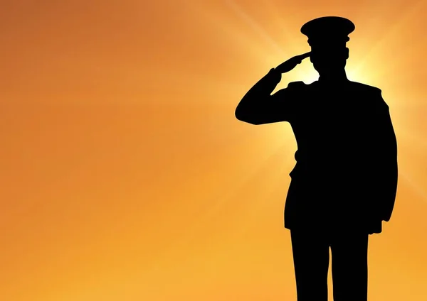 Captain silhouette saluting against sun — Stock Photo, Image