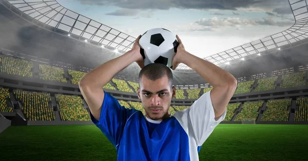 Confident man throwing soccer ball — Stock Photo, Image