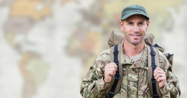 Soldier with backpack against  map — Stock Photo, Image