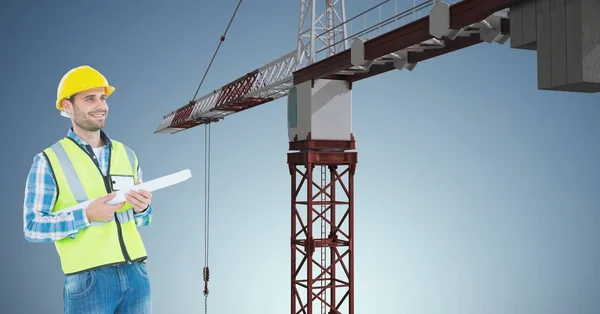 Architect holding blueprint against crane — Stock Photo, Image