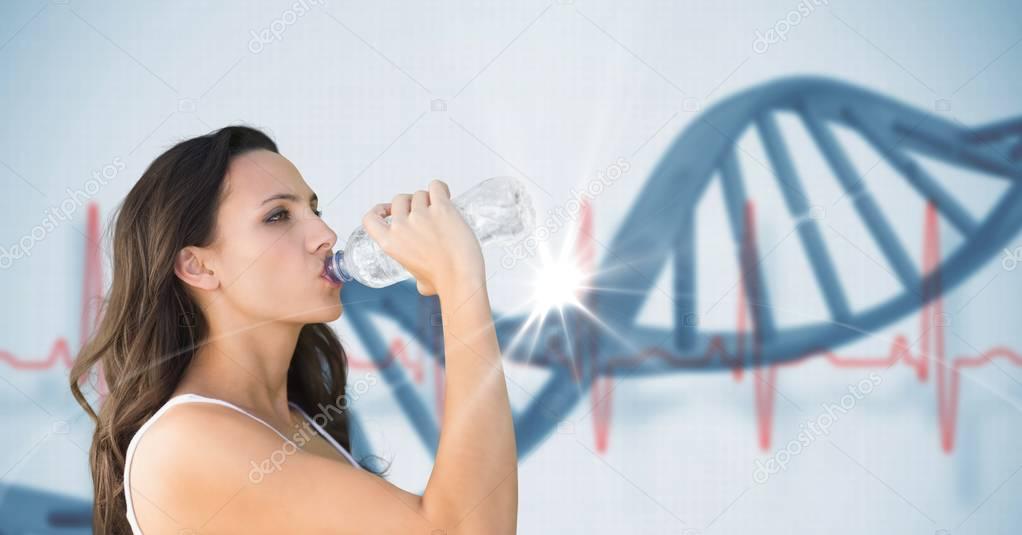 Young woman drinking water against DNA structure