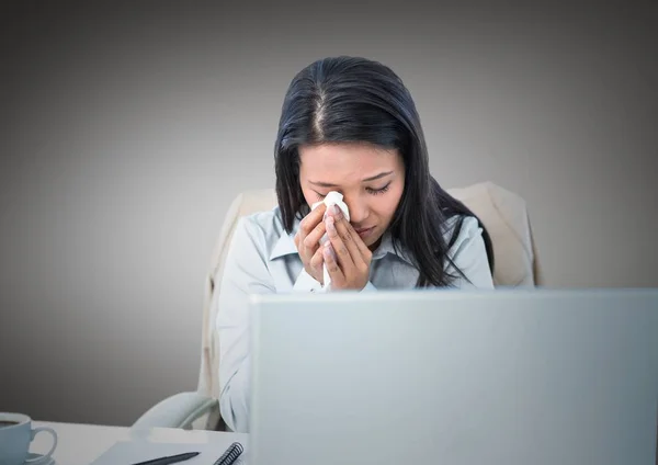 Woman crying at desk — Stock Photo, Image
