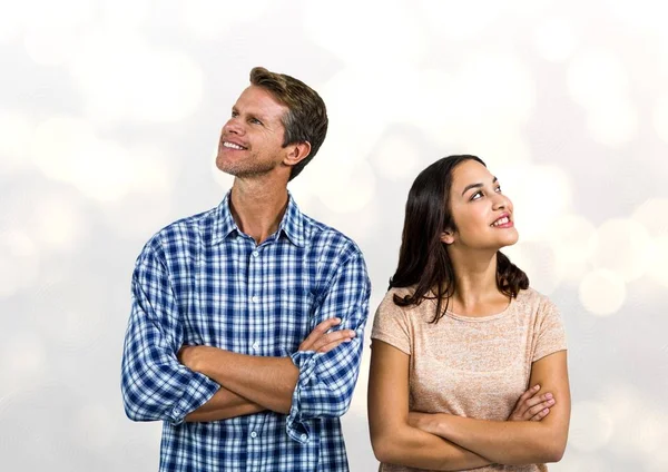 Smiling couple with arms crossed — Stock Photo, Image