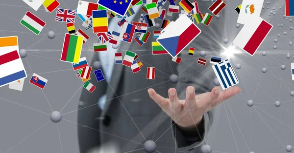 Various flags over hand — Stock Photo, Image