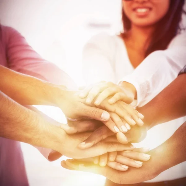 Businesswoman stacking hands with team — Stock Photo, Image