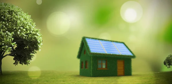 Modelo pequeno de casa verde com painéis solares — Fotografia de Stock