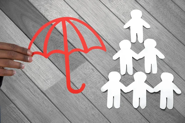 Композитное изображение руки с красным зонтиком — стоковое фото