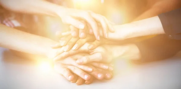 Business executives forming hand stack in office — Stock Photo, Image