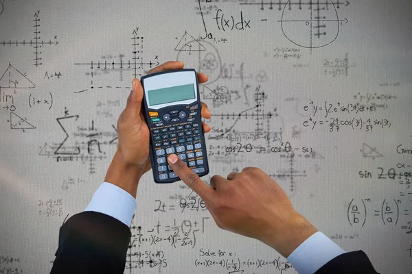 Businessman using calculator — Stock Photo, Image