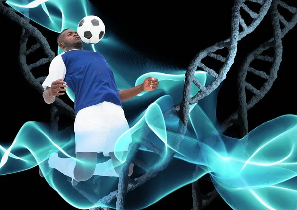 Joueur de football avec ballon et avec chaînes dna en pierre et fond noir et lumières bleues — Photo