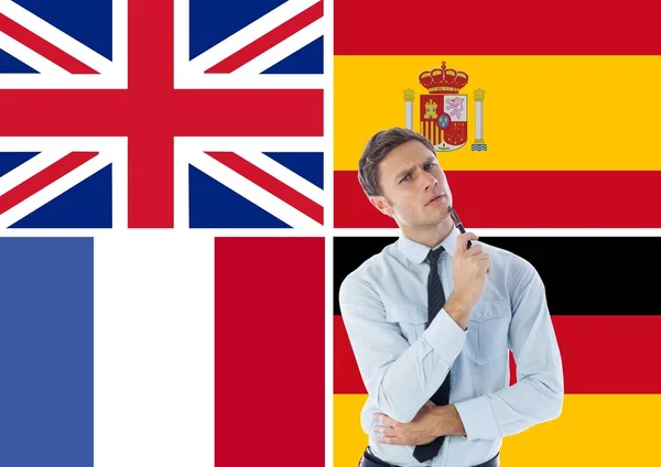 Main language flags around thoughtful man — Stock Photo, Image