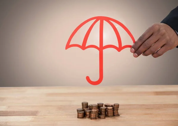 손에 동전 돈을 보호 우산을 잘라 — 스톡 사진