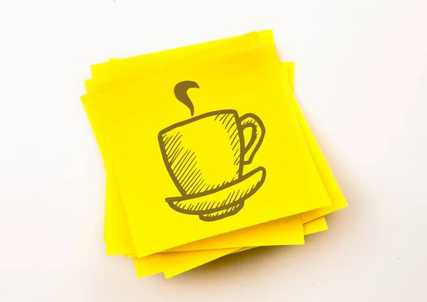 Brown coffee graphic against yellow sticky note — Stock Photo, Image