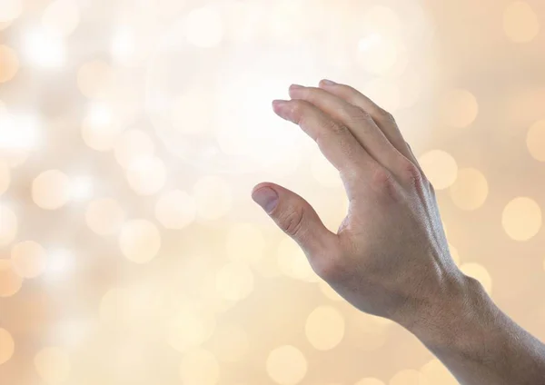 Hand touching brightness with sparkling light bokeh background — Stock Photo, Image