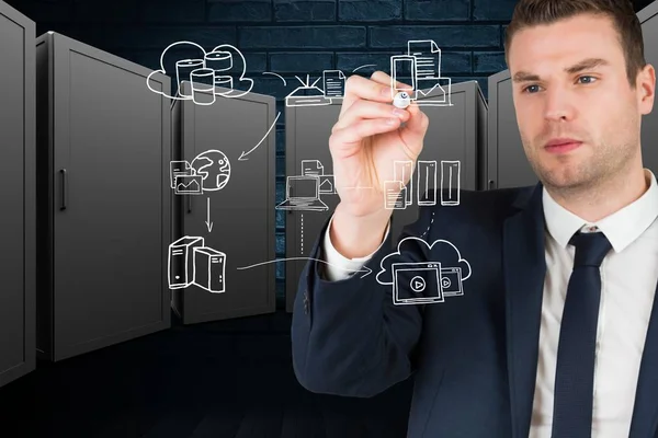 Businessman drawing ion the screen against server room background — Stock Photo, Image