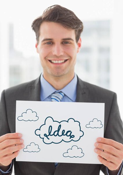 blue idea doodles on card held by business man smiling