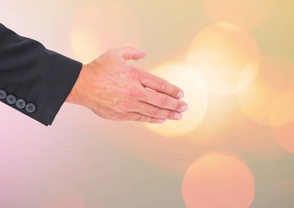 Hand die naar handsake met sprankelende licht bokeh achtergrond reikt — Stockfoto