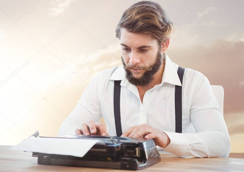 Hipster man  on typewriter with sunset