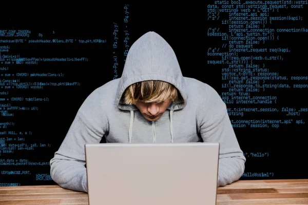 Hacker using his laptop against order lines — Stock Photo, Image