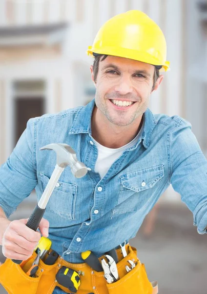 Carpenter with hammer on building site — Stock Photo, Image