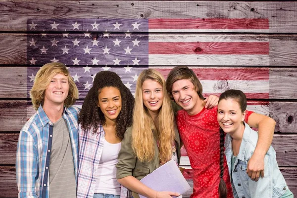 Students arm in arm against American flag on wooden wall — Stock Photo, Image