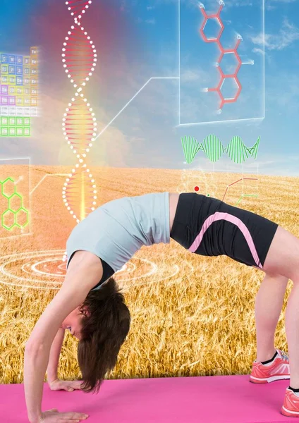 Kvinnan gör gymnastik med futuristiska dna-kedjan bakom i fältet — Stockfoto