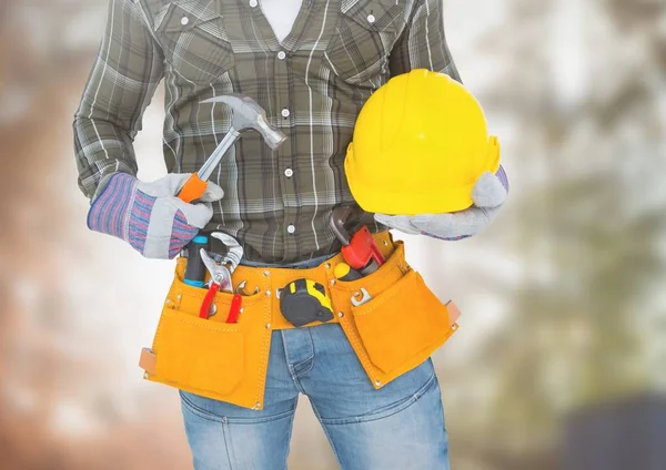 Carpenter with tools on building site — Stock Photo, Image