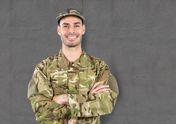 Happy soldier with cup. concrete wall — Stock Photo, Image