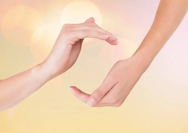 Mani in postura curva con sfondo bokeh luce scintillante — Foto Stock