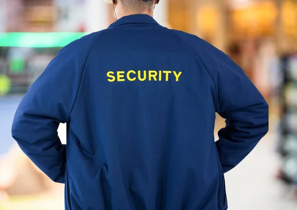 Guardia de seguridad de vuelta en el fondo de luces — Foto de Stock