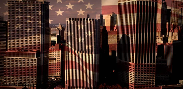 United states national flag against modern buildings — Stock Photo, Image