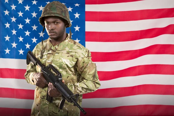 Confident soldier holding rifle — Stock Photo, Image